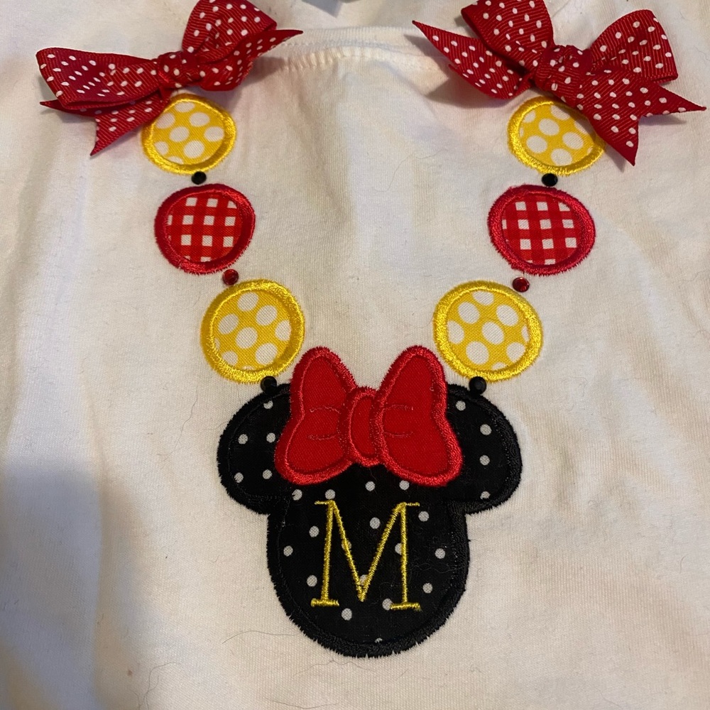 A Mickey Mouse shirt with M on front. This is a kids large - Picture 4 of 4